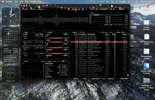 Snowy porta la neve che cade e le luci di Natale che scintillano sulla scrivania del tuo Mac